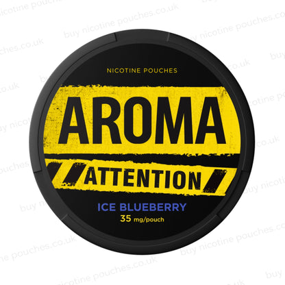 Black nicotine pouch container with yellow and blue Aroma Attention Ice Blueberry branding on a white background.