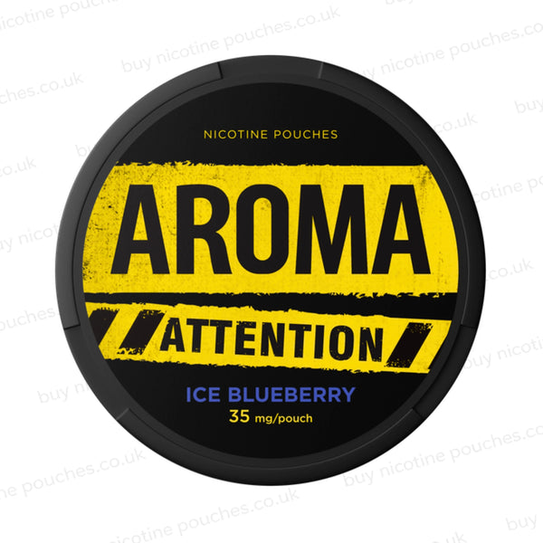 Black nicotine pouch container with yellow and blue Aroma Attention Ice Blueberry branding on a white background.