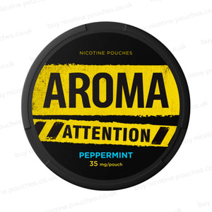 Black nicotine pouch container with yellow and blue Aroma Attention Peppermint branding on a white background.