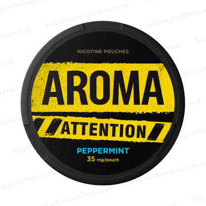 Black nicotine pouch container with yellow and blue Aroma Attention Peppermint branding on a white background.