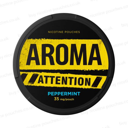 Black nicotine pouch container with yellow and blue Aroma Attention Peppermint branding on a white background.