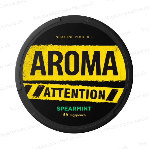 Black nicotine pouch container with yellow and green Aroma Attention Spearmint branding on a white background.