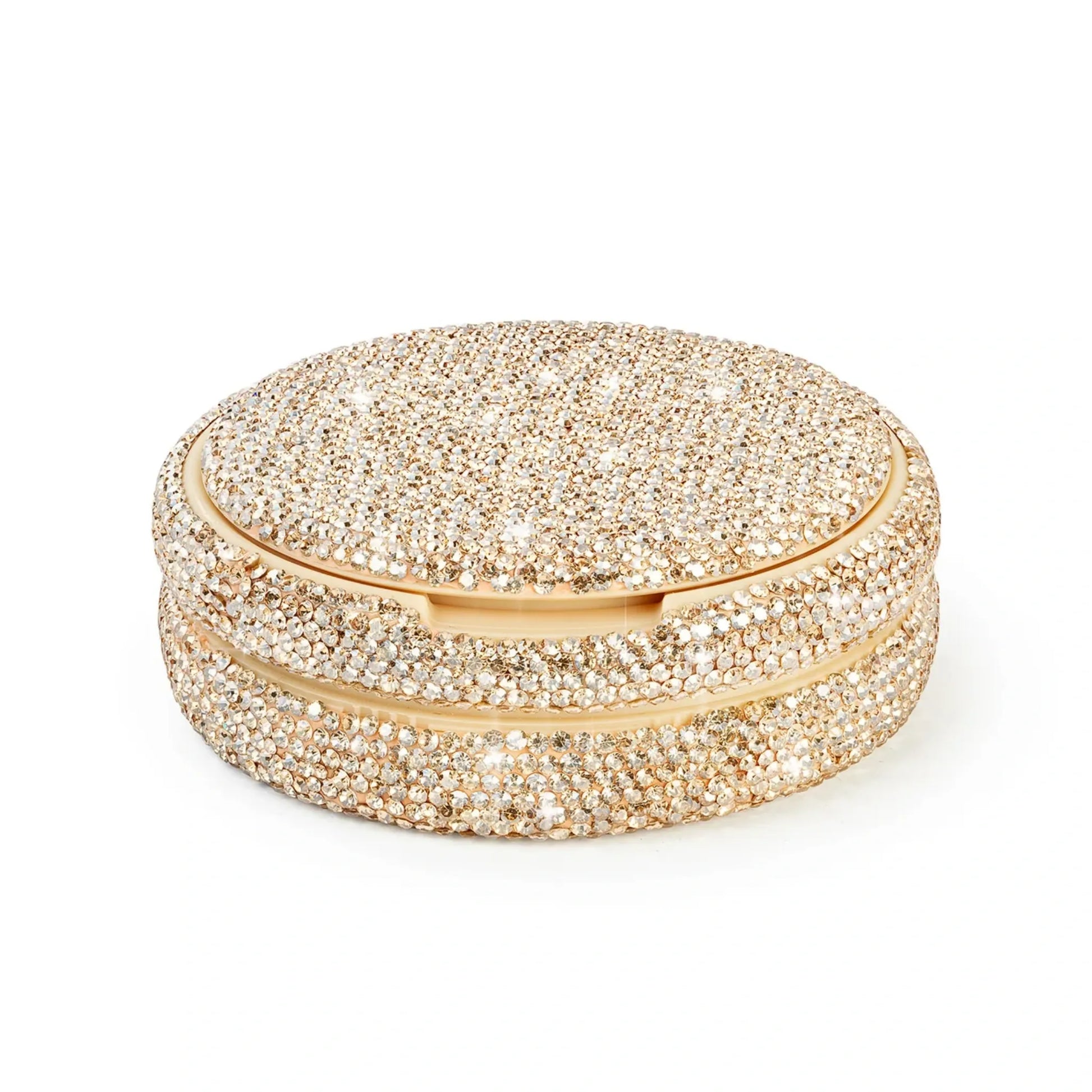 Product photo of a gold nicotine pouch tub covered in rhinestones.