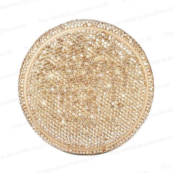 Product photo of a gold nicotine pouch tub covered in rhinestones.