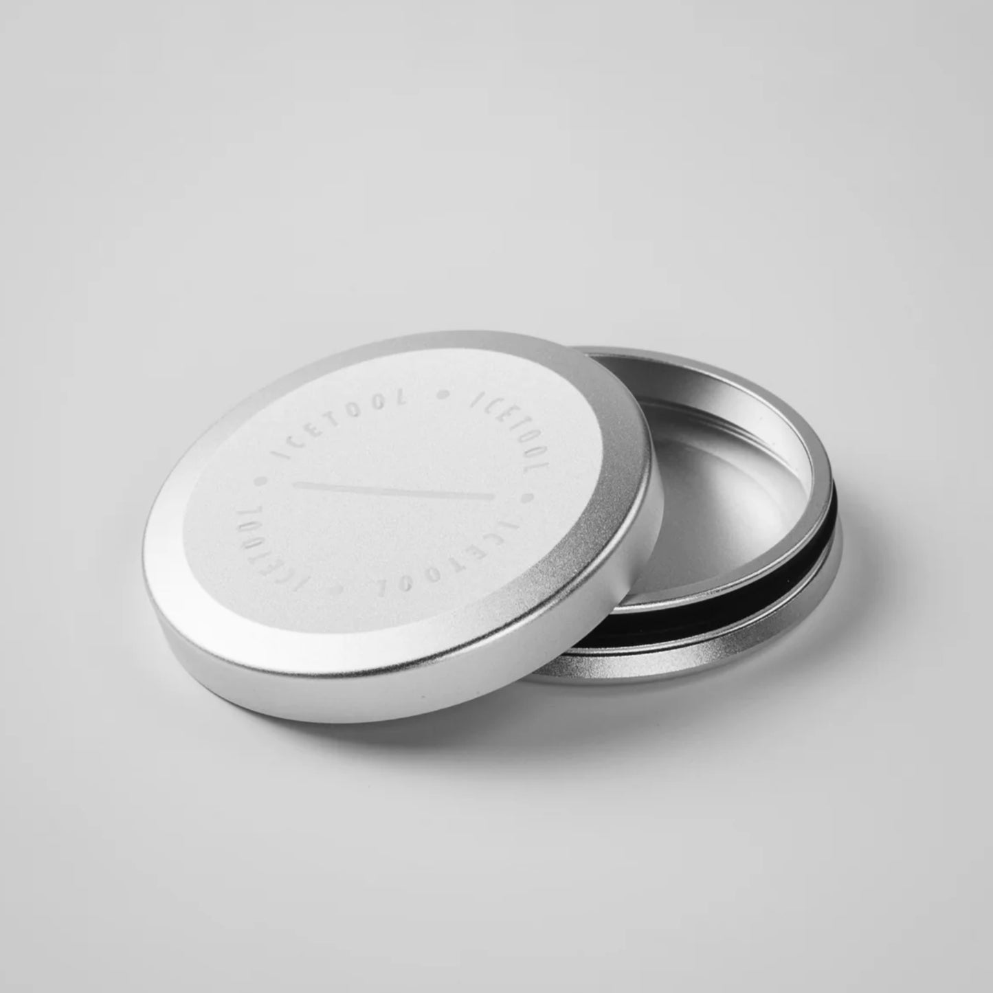 Open metallic round contained with Icetool branding on a grey background.