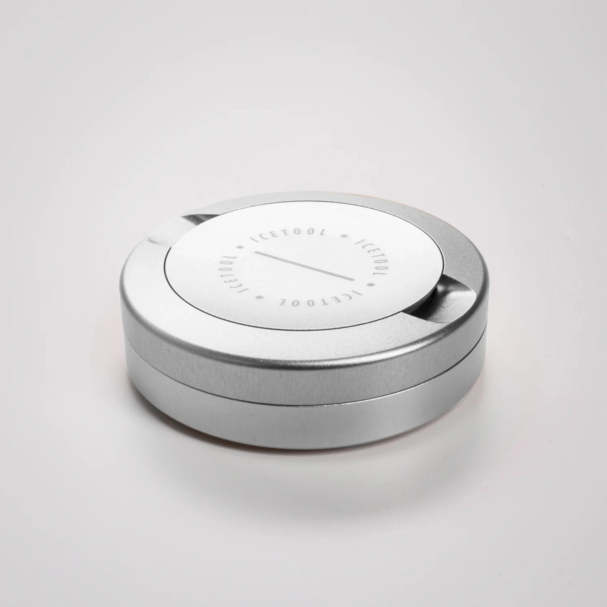 Silver circular container with Icetool branding on a grey background.