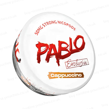 Angled shot of a nicotine pouch container with Pablo Cappuccino branding on a white background.