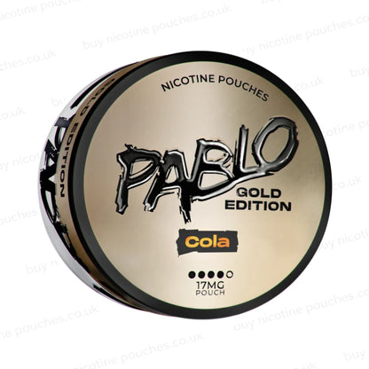 Angled shot of a nicotine pouch container with Pablo Gold Cola branding on a white background.