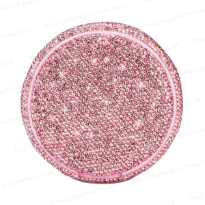 Product photo of a pink nicotine pouch tub covered in rhinestones.