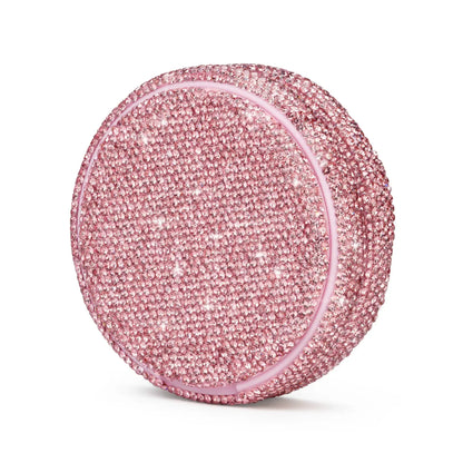 Angled product photo of a pink nicotine pouch tub covered in rhinestones.