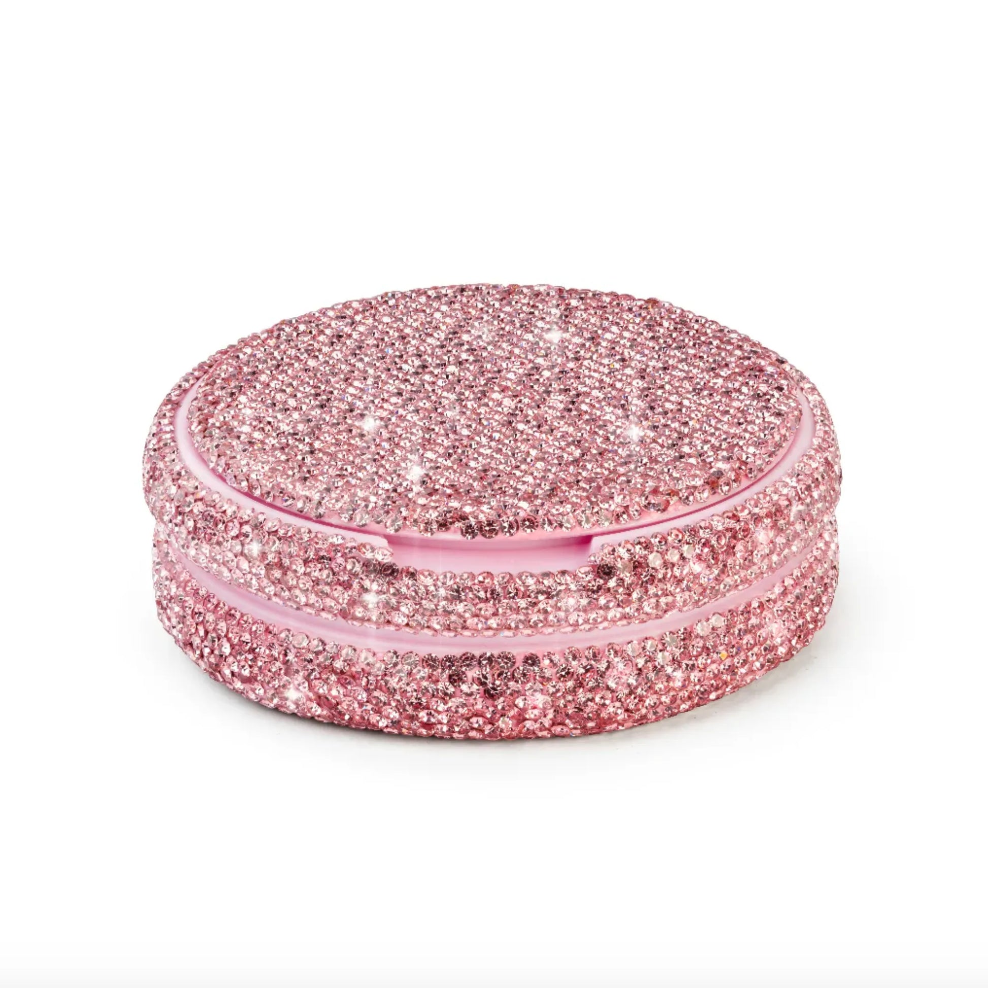 Angled product photo of a pink nicotine pouch tub covered in rhinestones.