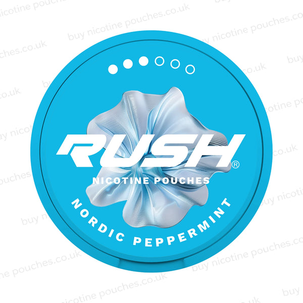 A round turquoise blue nicotine pouch can with a metallic silver flower graphic in the center, featuring the brand name 'RUSH' and the flavor 'Nordic Peppermint' on a white background with faint watermarks.