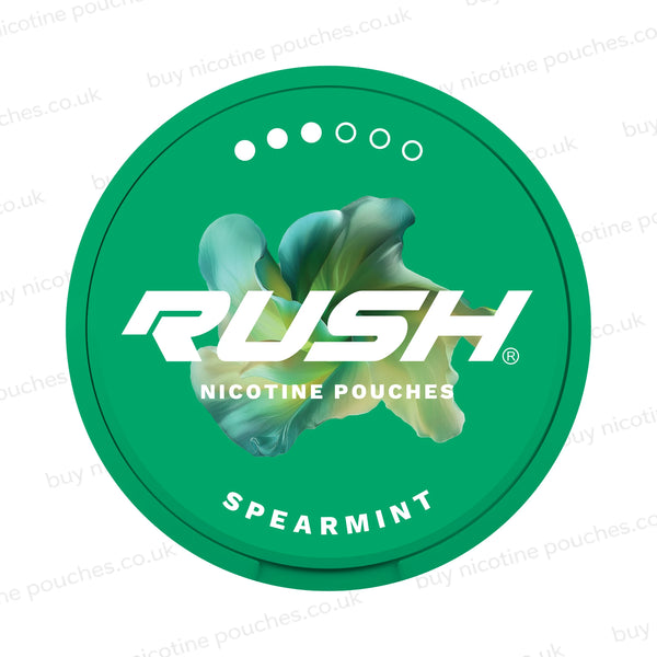Green packaging of Rush nicotine pouches with spearmint flavor on a white background.