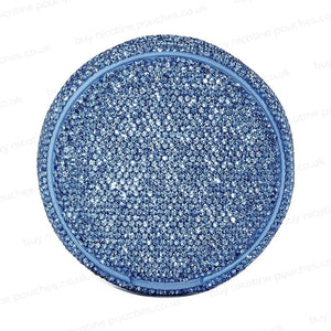 Circular container covered in blue rhinestones on a white background.