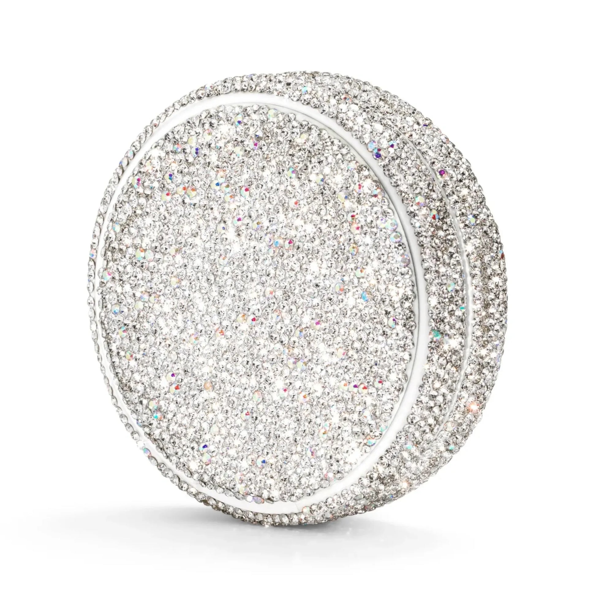 Angled shot of a circular container covered in silver rhinestones on a white background.