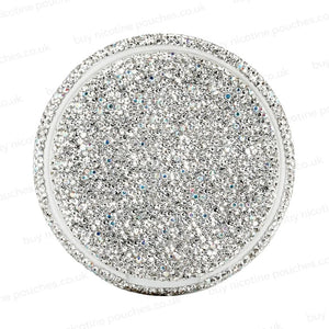 Silver circular container covered in rhinestones on a white background.