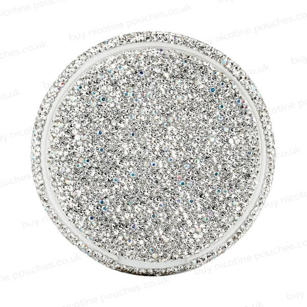 Silver circular container covered in rhinestones on a white background.